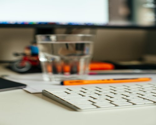 water and a simple lunch on a work desk